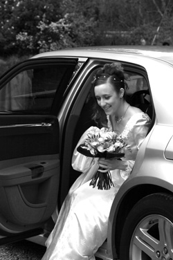 black white wedding photography bride leaving car